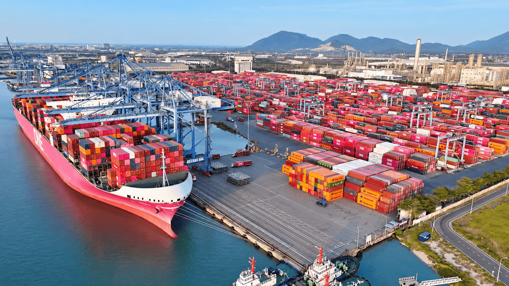 Aerial view of a cargo ship and container terminal, representing documented and tracked shipments to the port